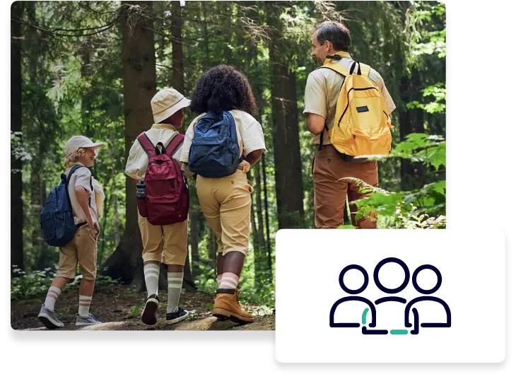 A group of scouts hiking while carrying backpacks.
