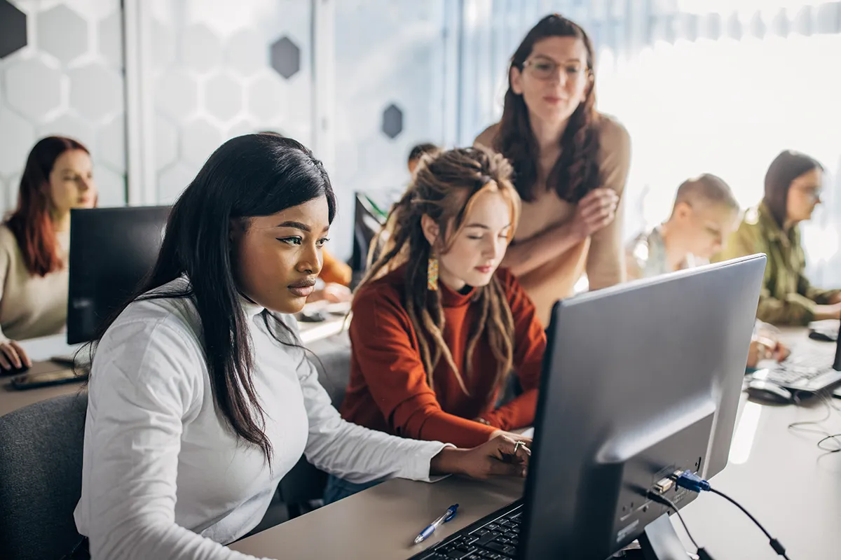 Supervisor helping her employees complete Mandated Reporter Training.
